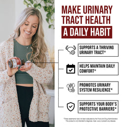 Woman taking Triquetra CranEaze cranberry extract capsules for daily urinary tract health support