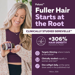 Woman holding Folura saw palmetto softgel bottle, taking one softgel daily in a bright everyday setting